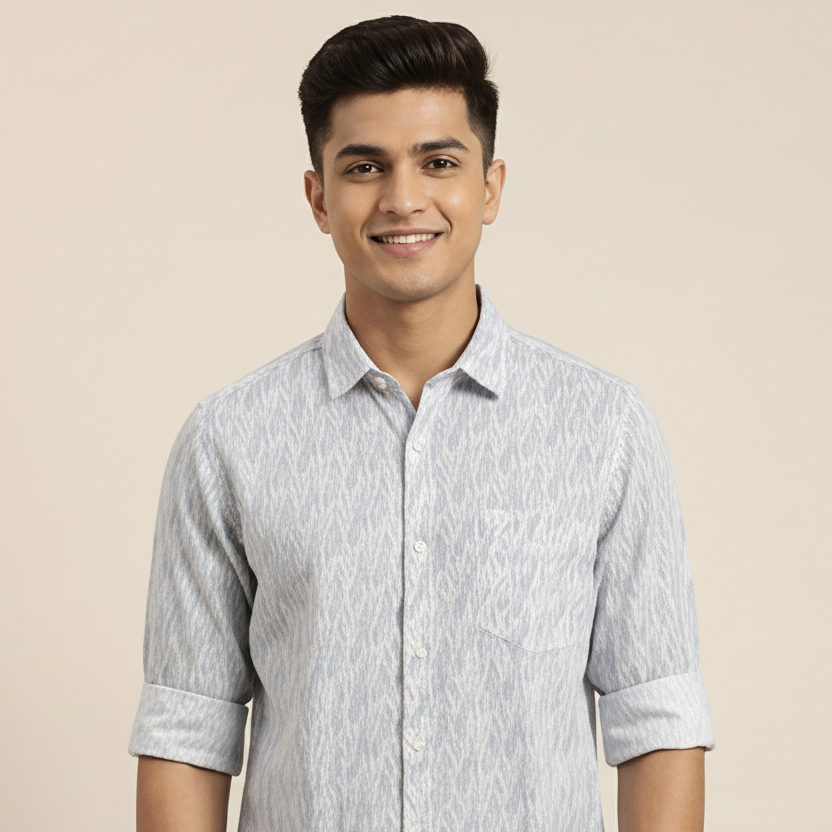 Man wearing a light gray patterned shirt against a beige background