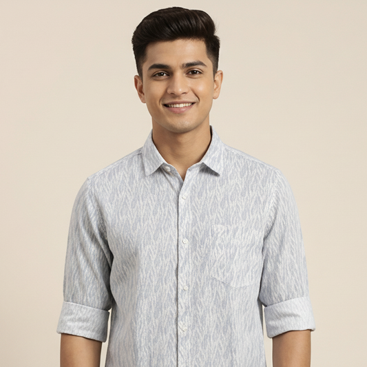 Man wearing a light gray patterned shirt against a beige background
